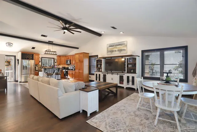 a living room with furniture and flat screen tv