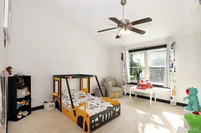 a bedroom with furniture and a window