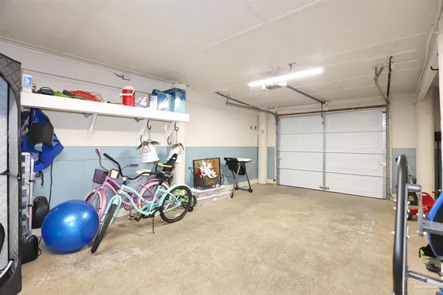 a view of a house with swimming pool and sitting area