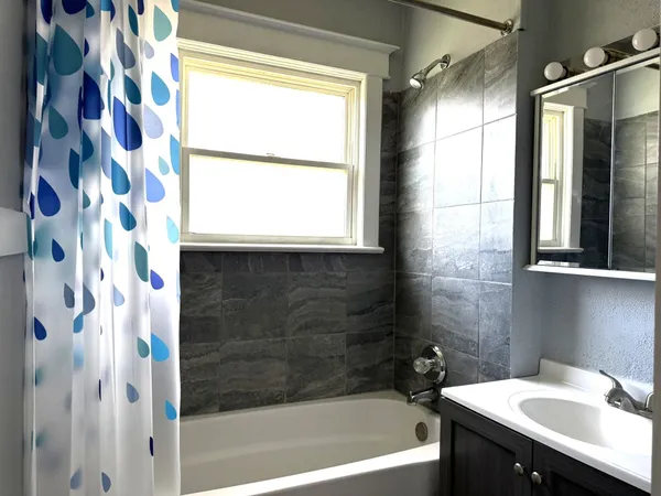 a bathroom with a sink and a bathtub