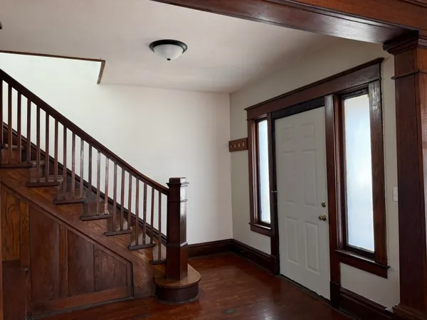 a view of entryway with wooden floor