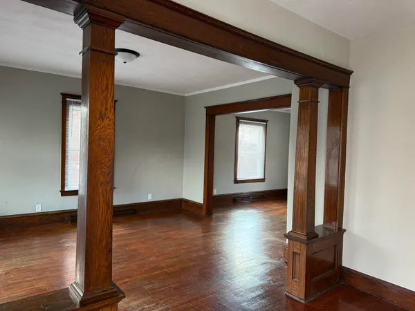 a view of front door with wooden floor