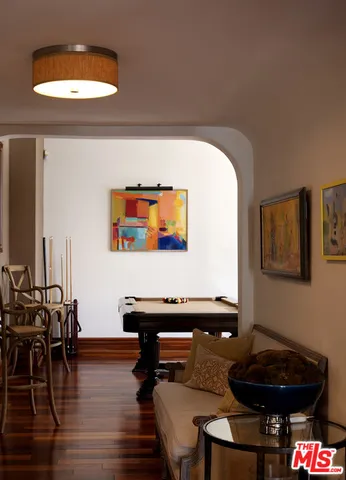 a view of a livingroom with furniture and bathroom