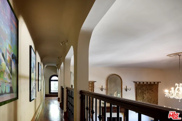 a bedroom with a bed a couch and dresser