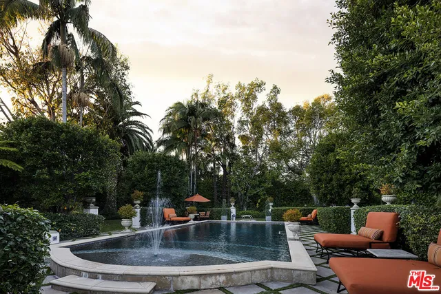 a view of a backyard with sitting area