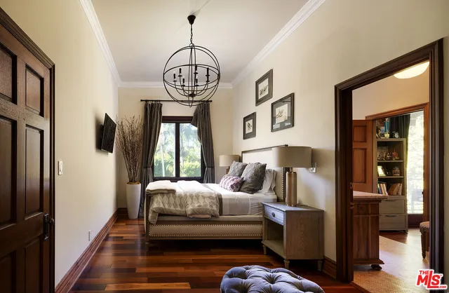 a living room with furniture a rug and a large window