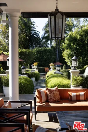a outdoor living space with furniture and a fireplace