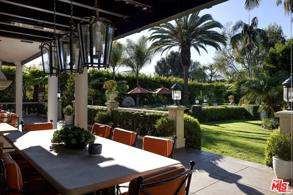 a view of swimming pool with a patio