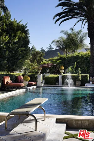 a view of swimming pool with a patio