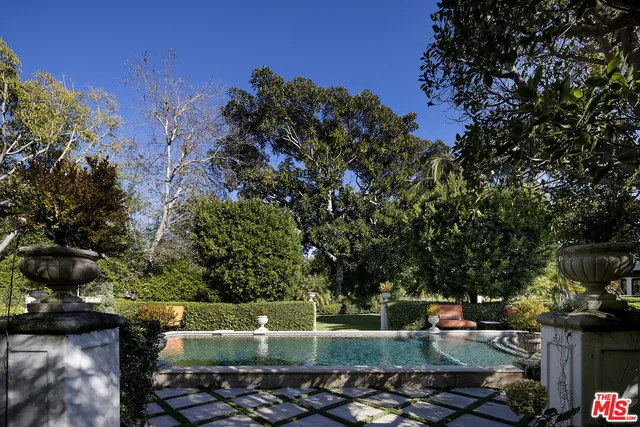 a view of swimming pool with a patio