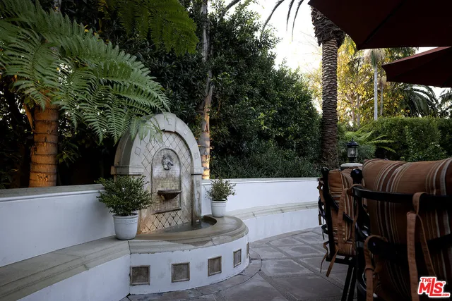 an aerial view of a house with a yard and garden