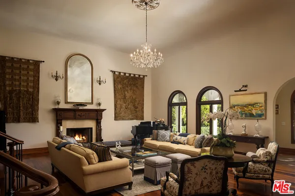 a living room with a fireplace and a fireplace
