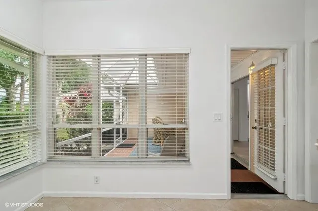 a view of a door and a window