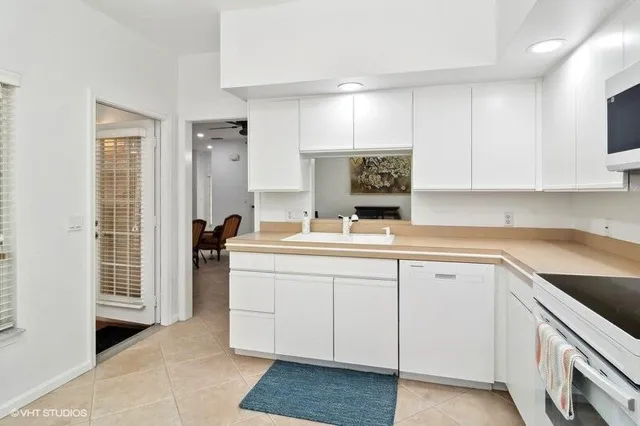 a kitchen with a sink and cabinets
