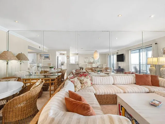 a living room with furniture and a table