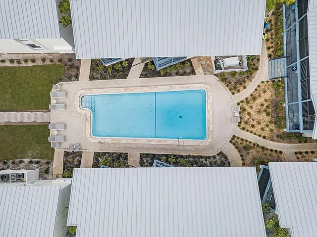 an aerial view of a house with a floor to ceiling window