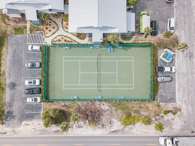 a view of a two room with furniture and a window