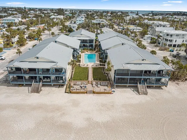 an aerial view of a house with roof deck