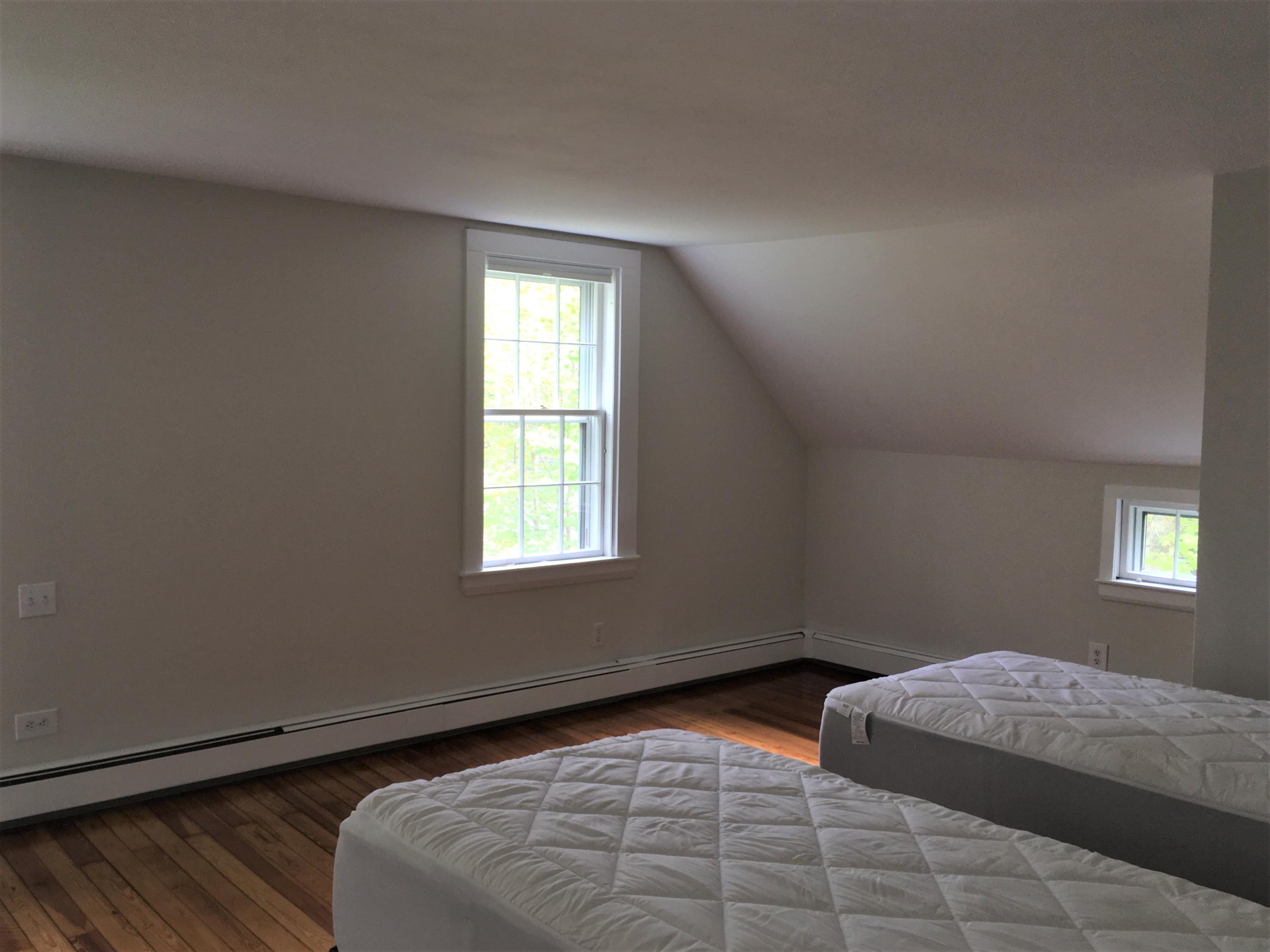99 Main Street Sandwich, MA 02563 - Photo 13 of 17 a bedroom with bed and window