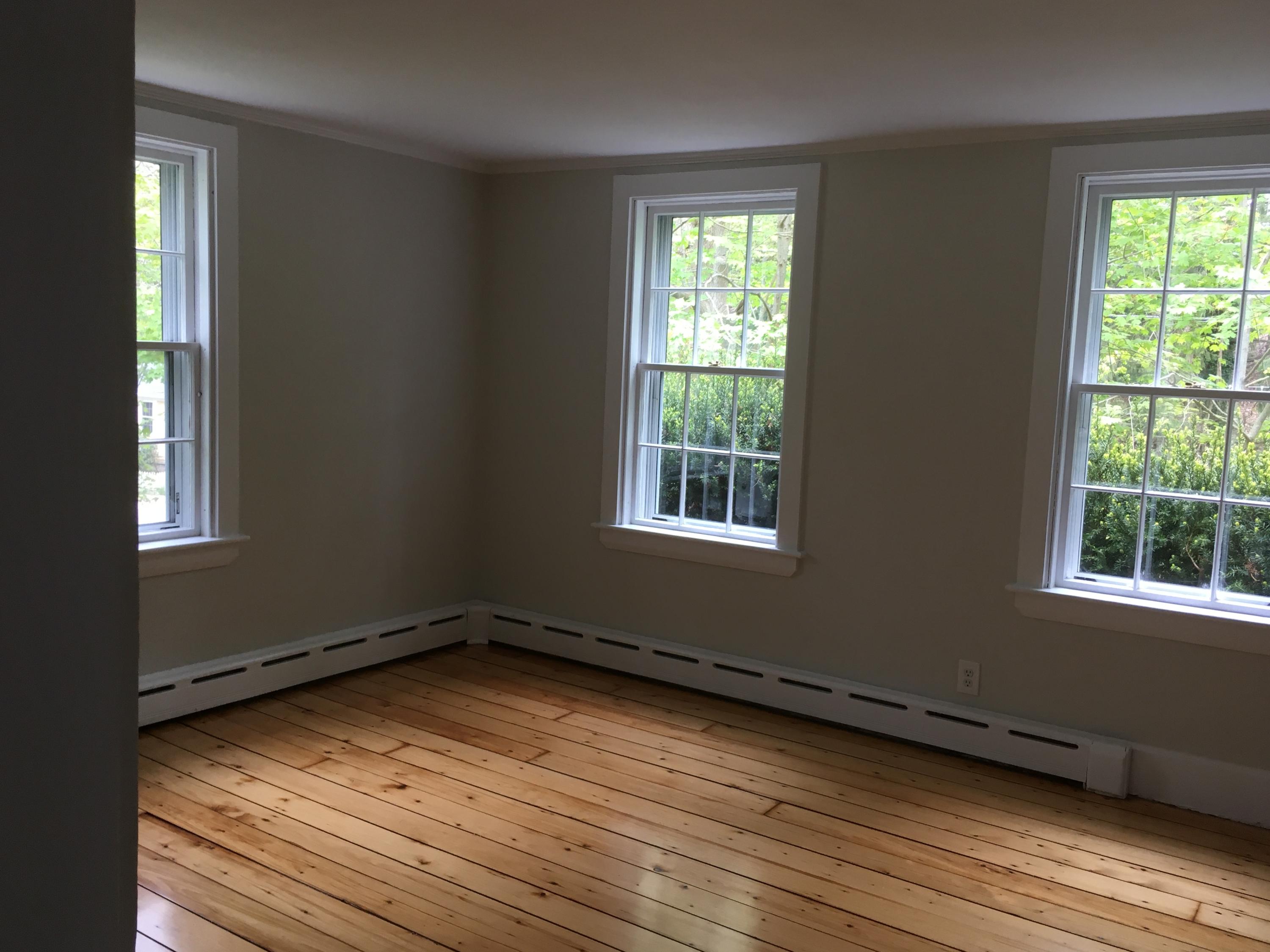 99 Main Street Sandwich, MA 02563 - Photo 6 of 17 an empty room with wooden floor and windows