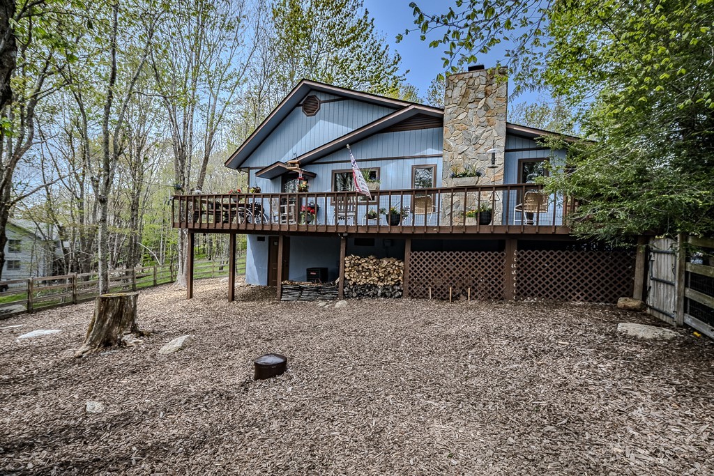 103-105 Upper Grouse Ridge Road Beech Mountain, NC 28604 - Photo 4 of 48 a view of a house with a yard