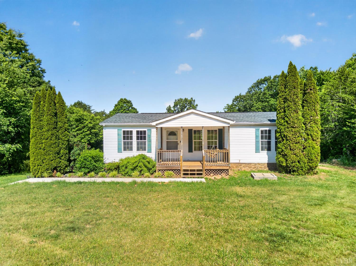 1811 Mohawk Road Gladys, VA 24554 - Photo 2 of 51 a front view of a house with garden