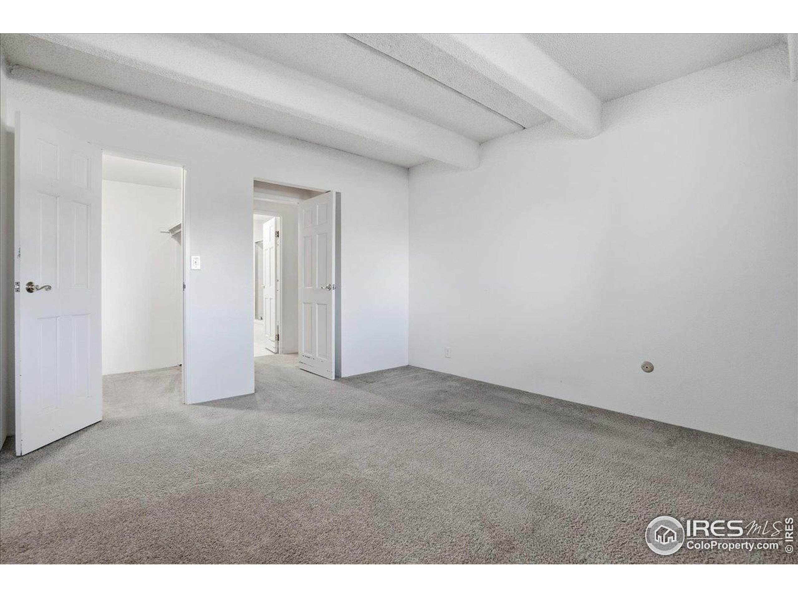 415 South Howes Street, Unit N206 Fort Collins, CO 80521 - Photo 17 of 48 a view of an empty room and closet