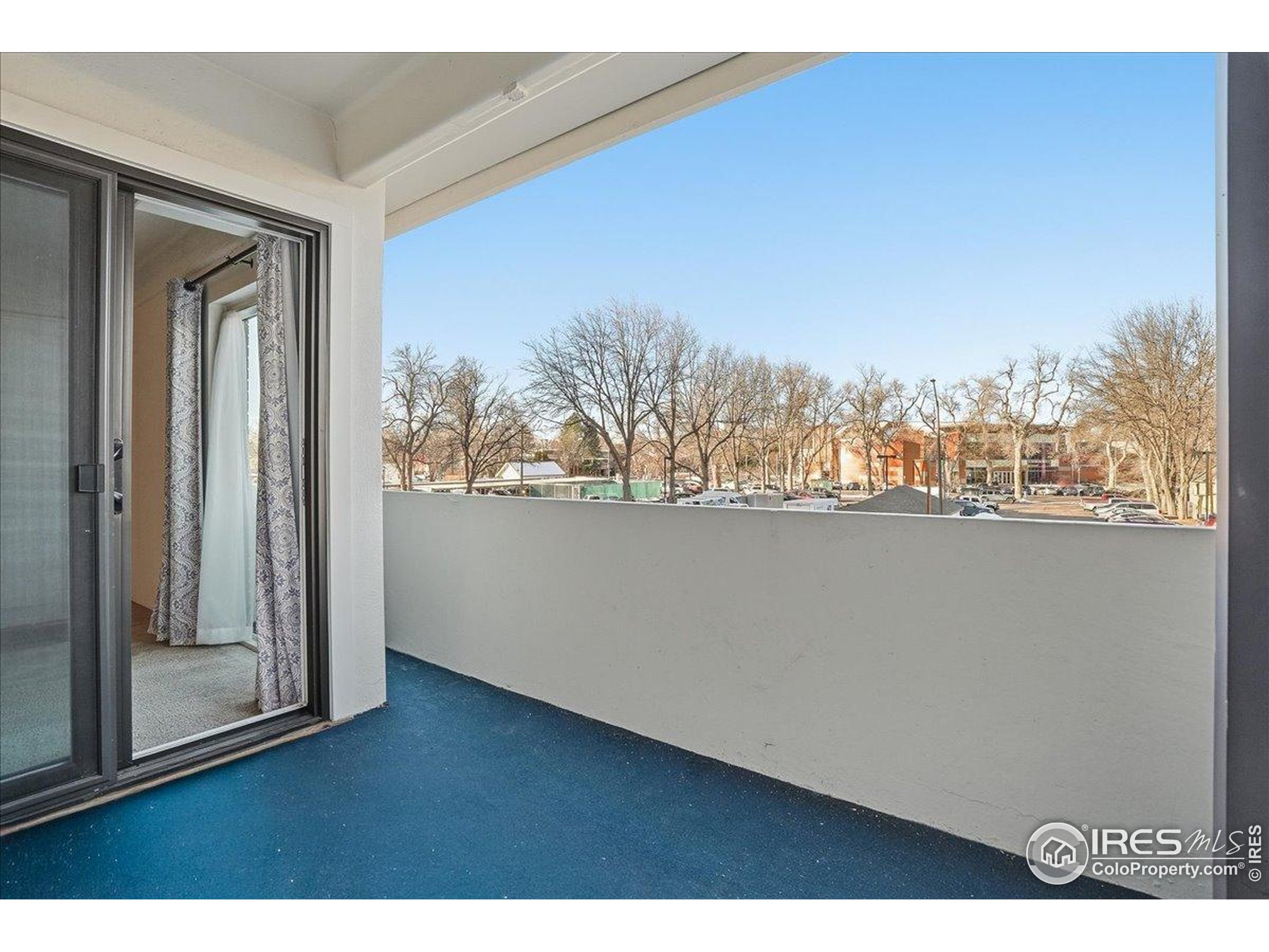 415 South Howes Street, Unit N206 Fort Collins, CO 80521 - Photo 23 of 48 a view of a room with wooden floor and city view