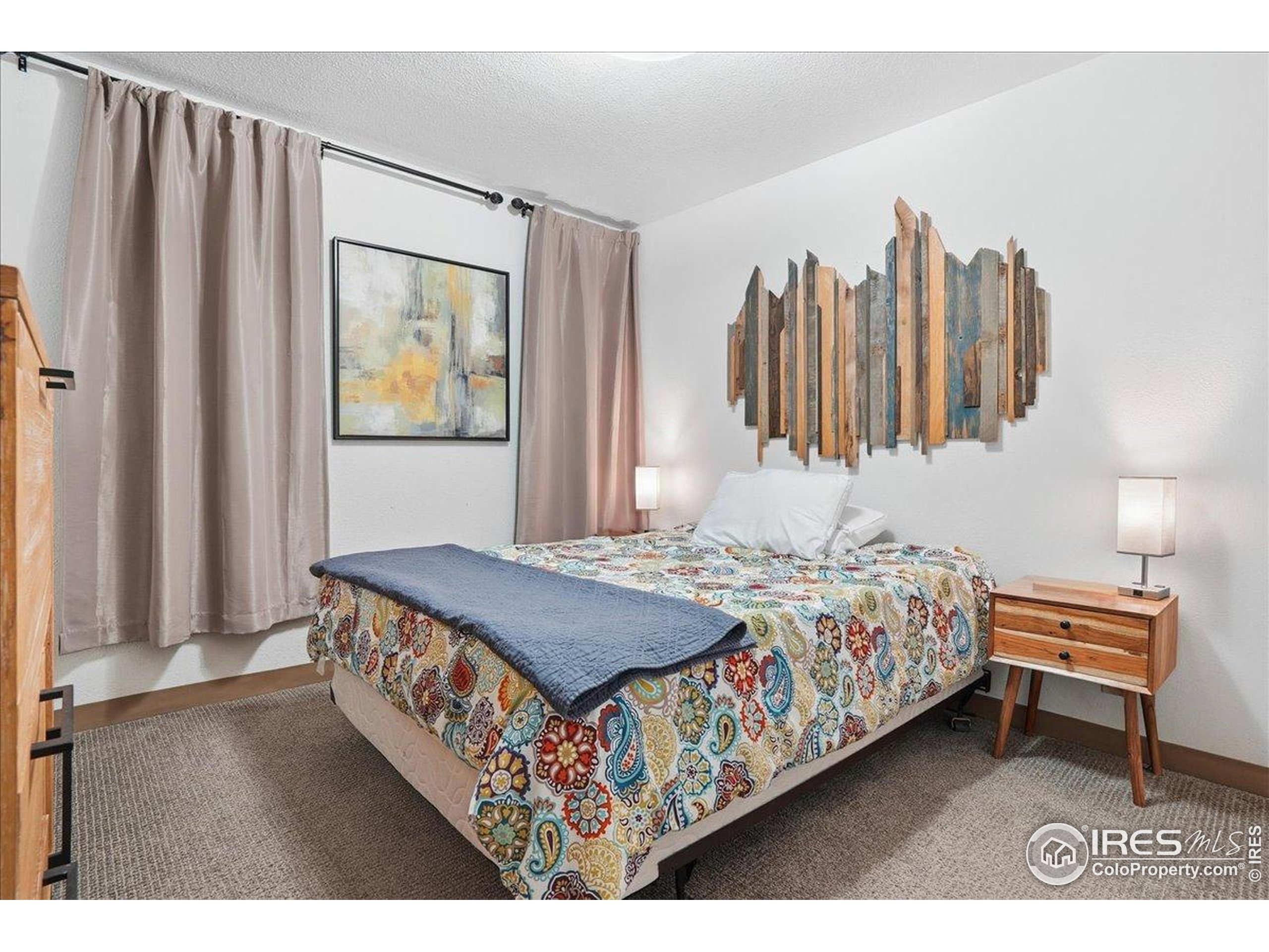 415 South Howes Street, Unit N206 Fort Collins, CO 80521 - Photo 39 of 48 a bedroom with a bed and a window