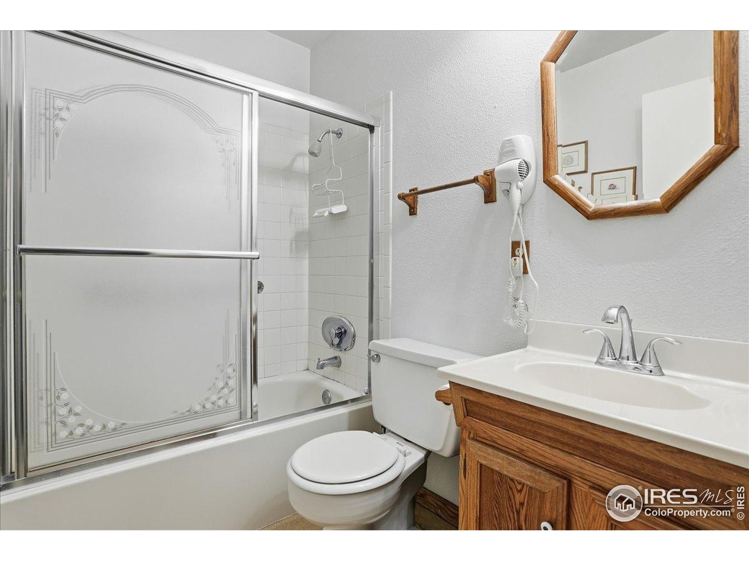 415 South Howes Street, Unit N206 Fort Collins, CO 80521 - Photo 42 of 48 a bathroom with a sink toilet and shower