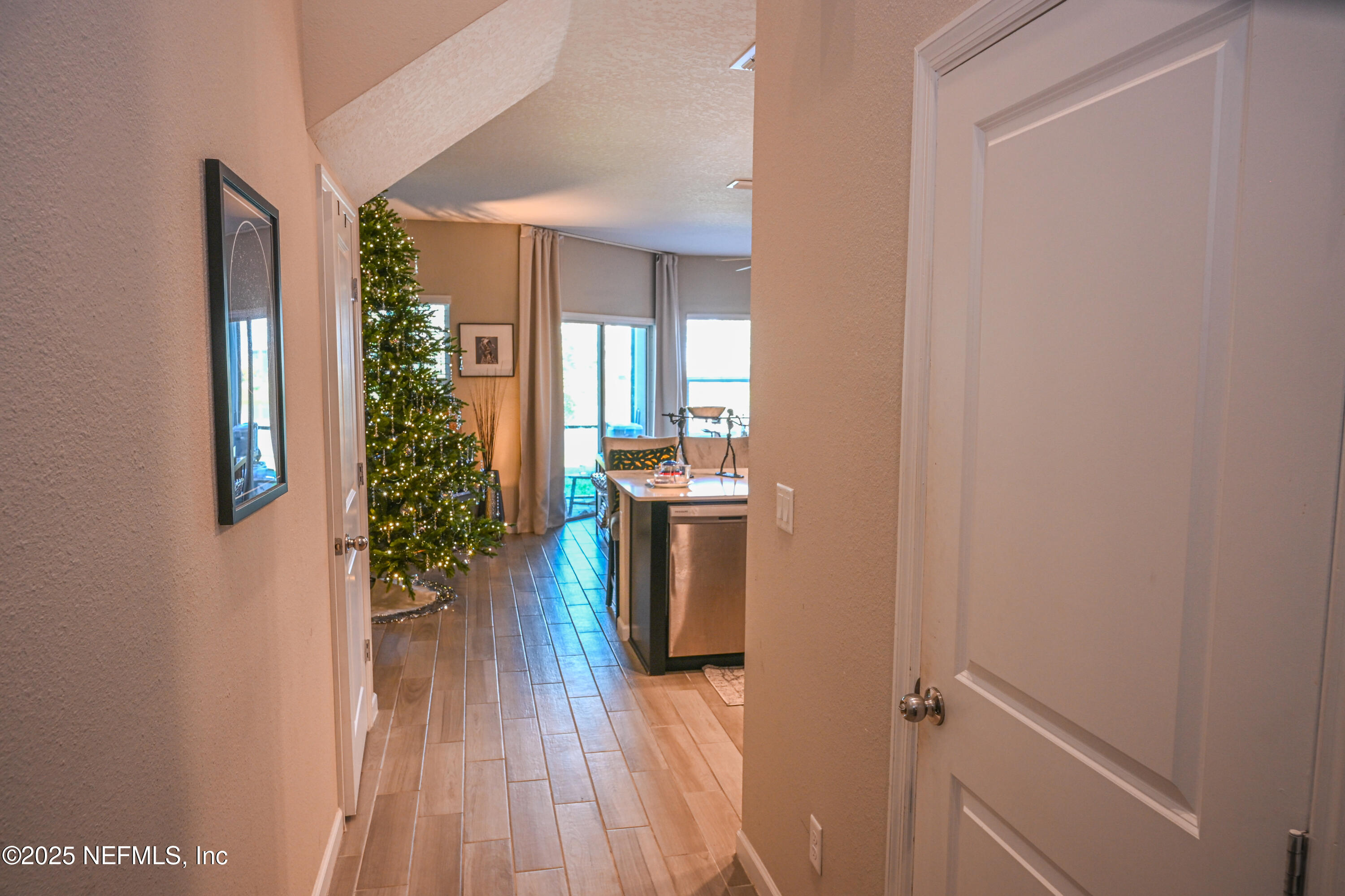 441 Boracay Circle St. Johns, FL 32259 - Photo 18 of 40 a view of a hallway with wooden floor and a living room