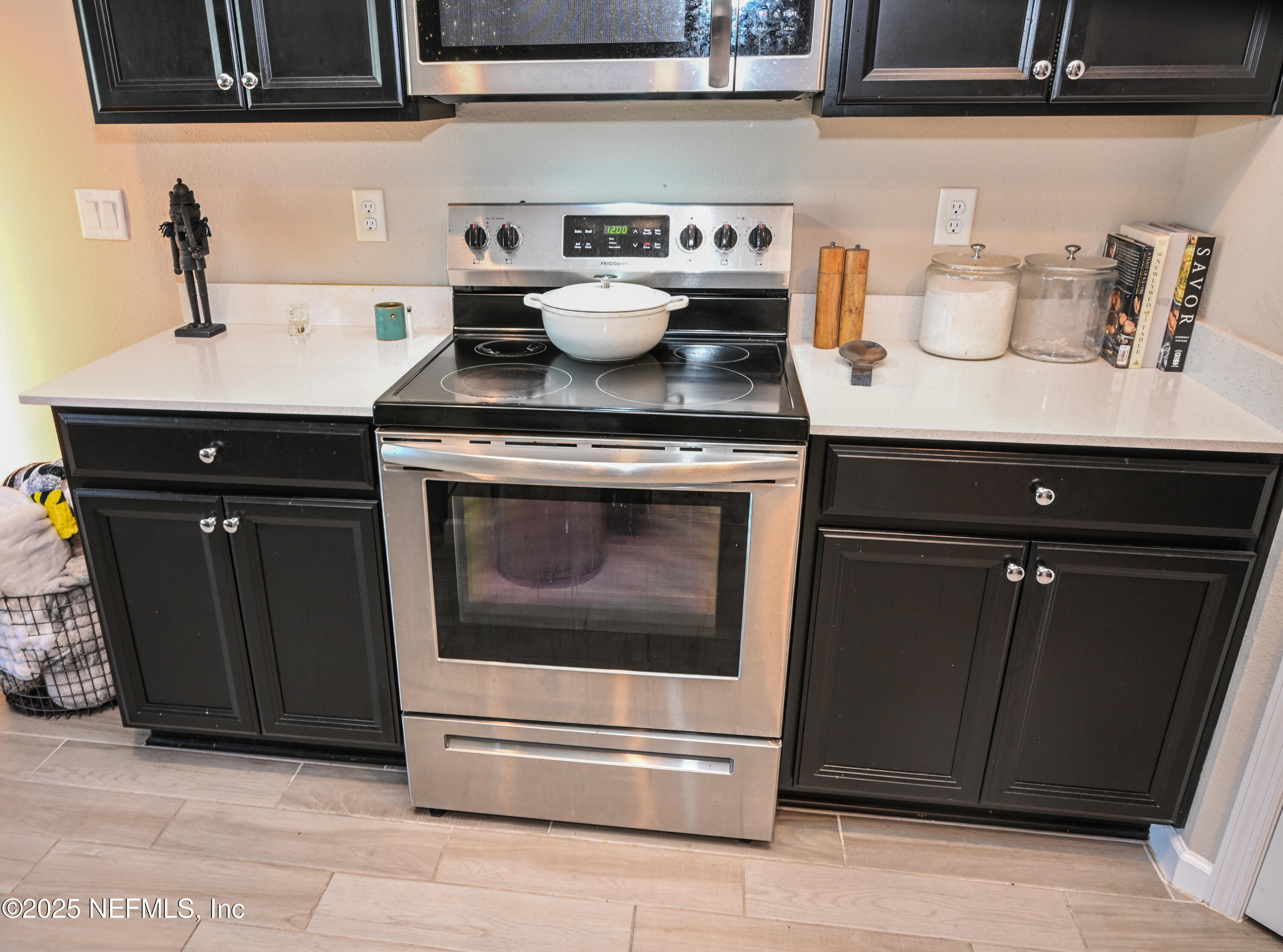 441 Boracay Circle St. Johns, FL 32259 - Photo 23 of 40 a kitchen with stainless steel appliances granite countertop a stove and a cabinets