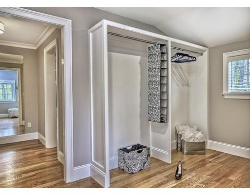 141 Shade Street Lexington, MA 02421 - Photo 23 of 30 a view of a hallway with wooden floor and windows