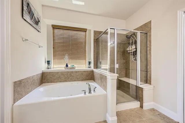 a bath tub sitting next to a window