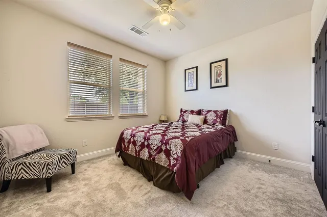 a bed room with a bed and a couch