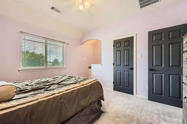 a bedroom with a bed and a closet