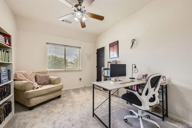 a workspace with furniture and a window