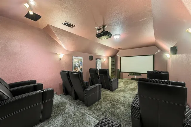 a living room with furniture a ceiling fan and a rug