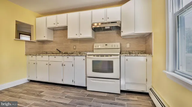 a view of storage and utility room with racks on the wall