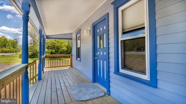 a view of a hallway with a dining area
