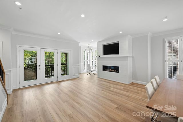 a living room with furniture fireplace and flat screen tv