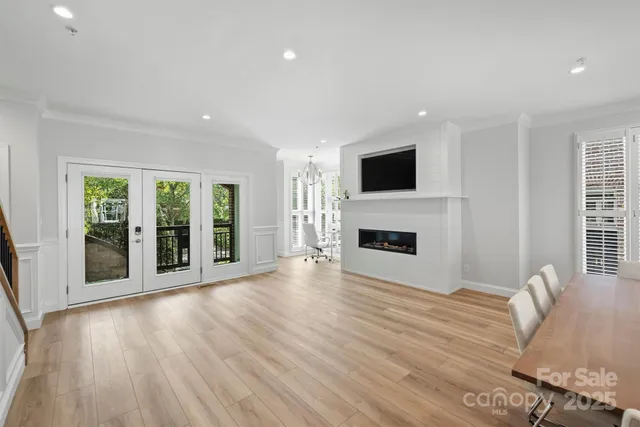 a living room with furniture fireplace and flat screen tv