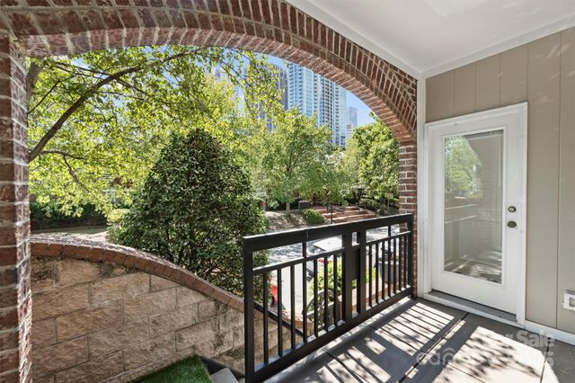 a view of balcony with wooden floor
