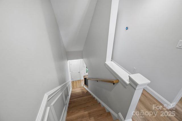 a view of a hallway with staircase