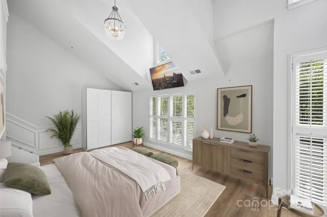 a bedroom with a large bed and a window