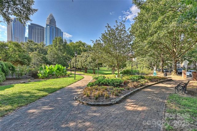 a view of a backyard with large trees