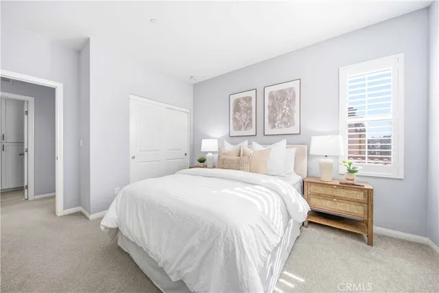 a bathroom with double sink and a mirror