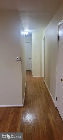 a view of hallway with an empty room