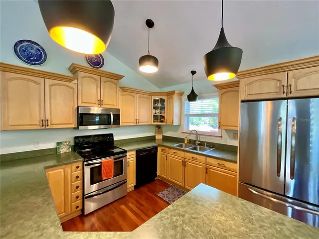 a view of living room with furniture and a large window