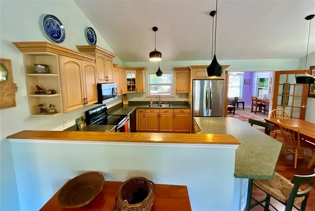 a living room with furniture rug and window